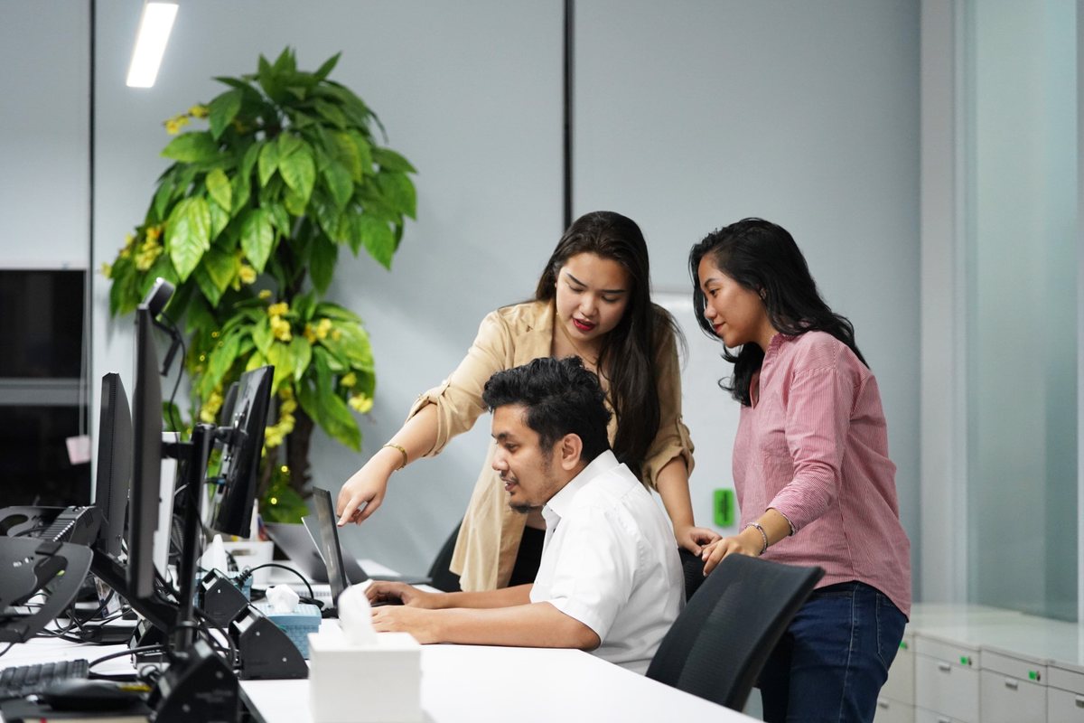 Logiframe colleagues working together at a desk.