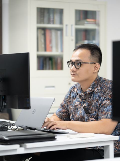 A team member working at a desk