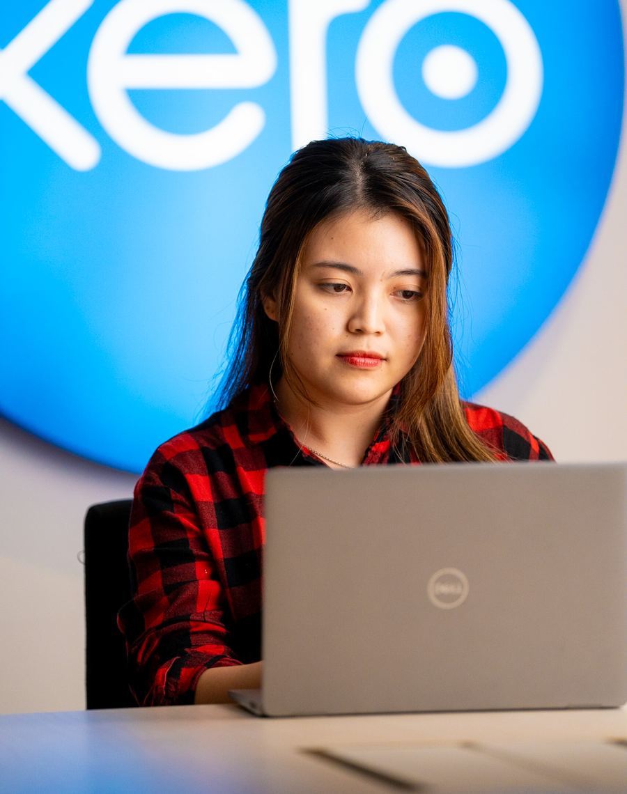 A Logiframe accountant working in Xero at the team's office.