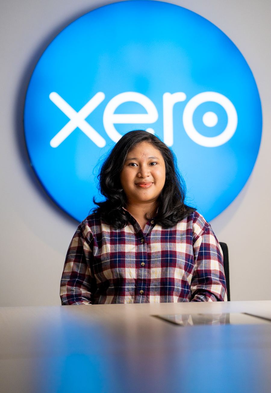 A Logiframe bookkeeper smiling at the team's office.