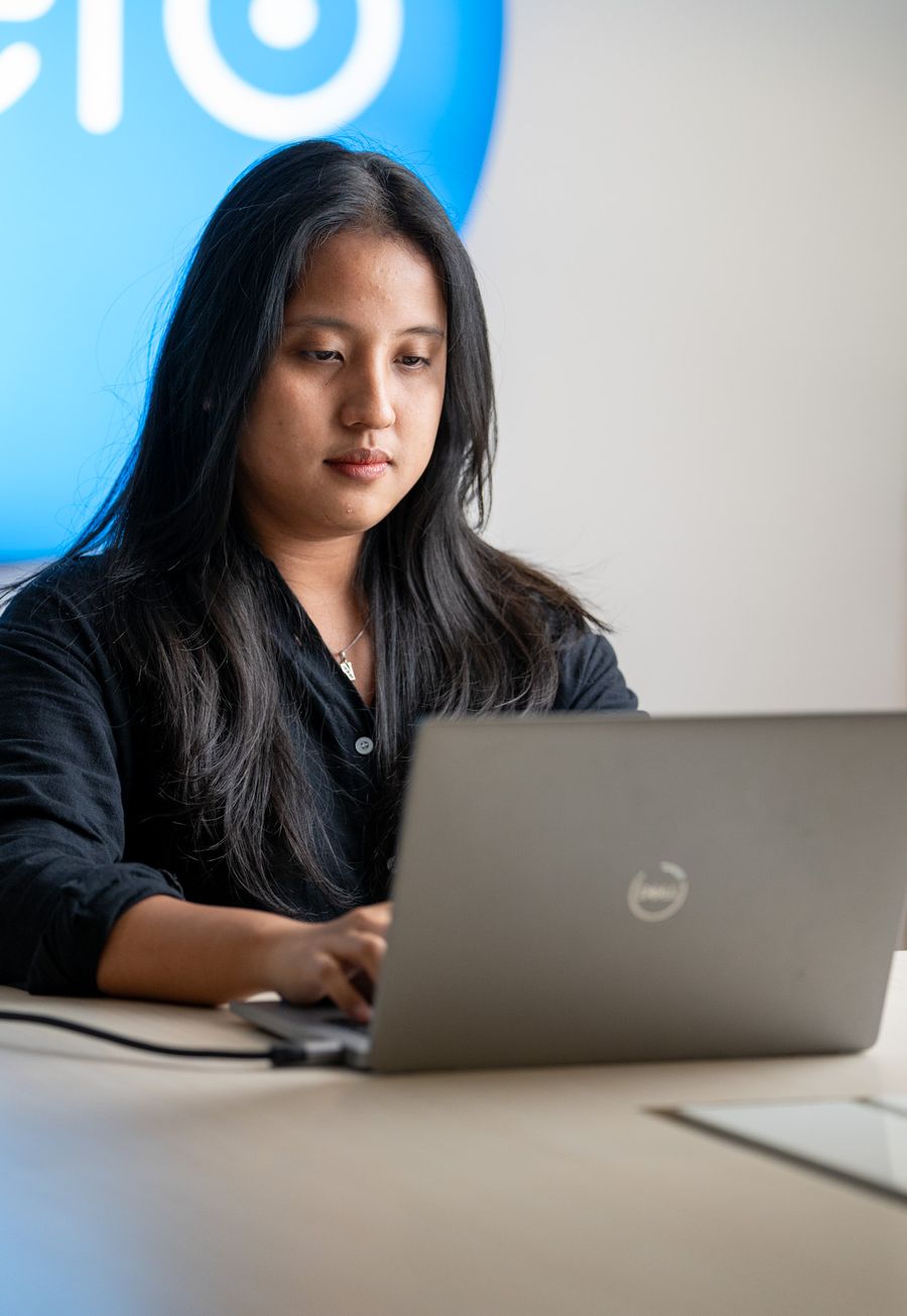A Logiframe bookkeeper working in Xero at the team's office.